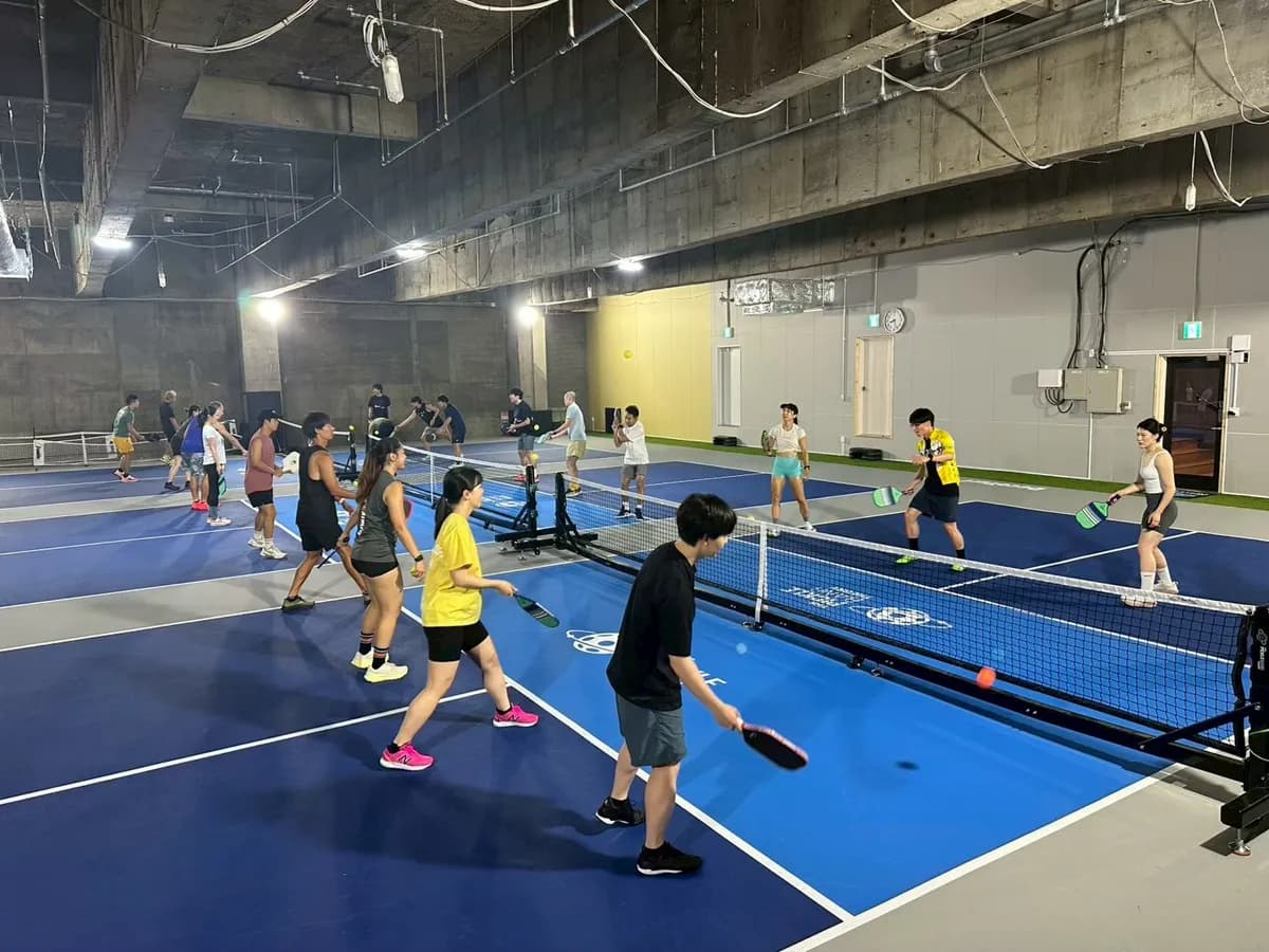 Players enjoying pickleball on the indoor courts